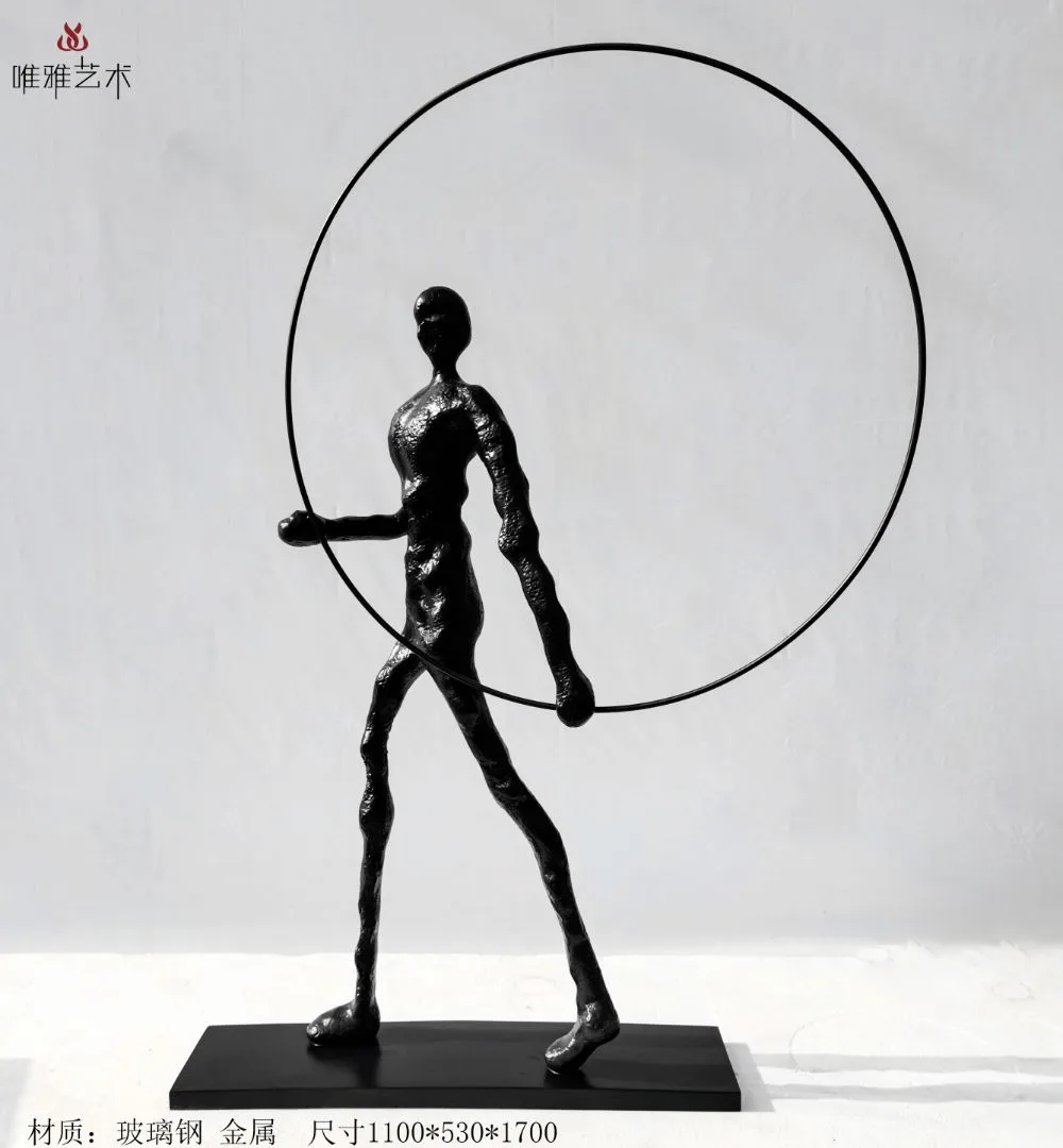 Existing Weiya catalogue photograph of a standing metal figure inside a wide circular sculptural element