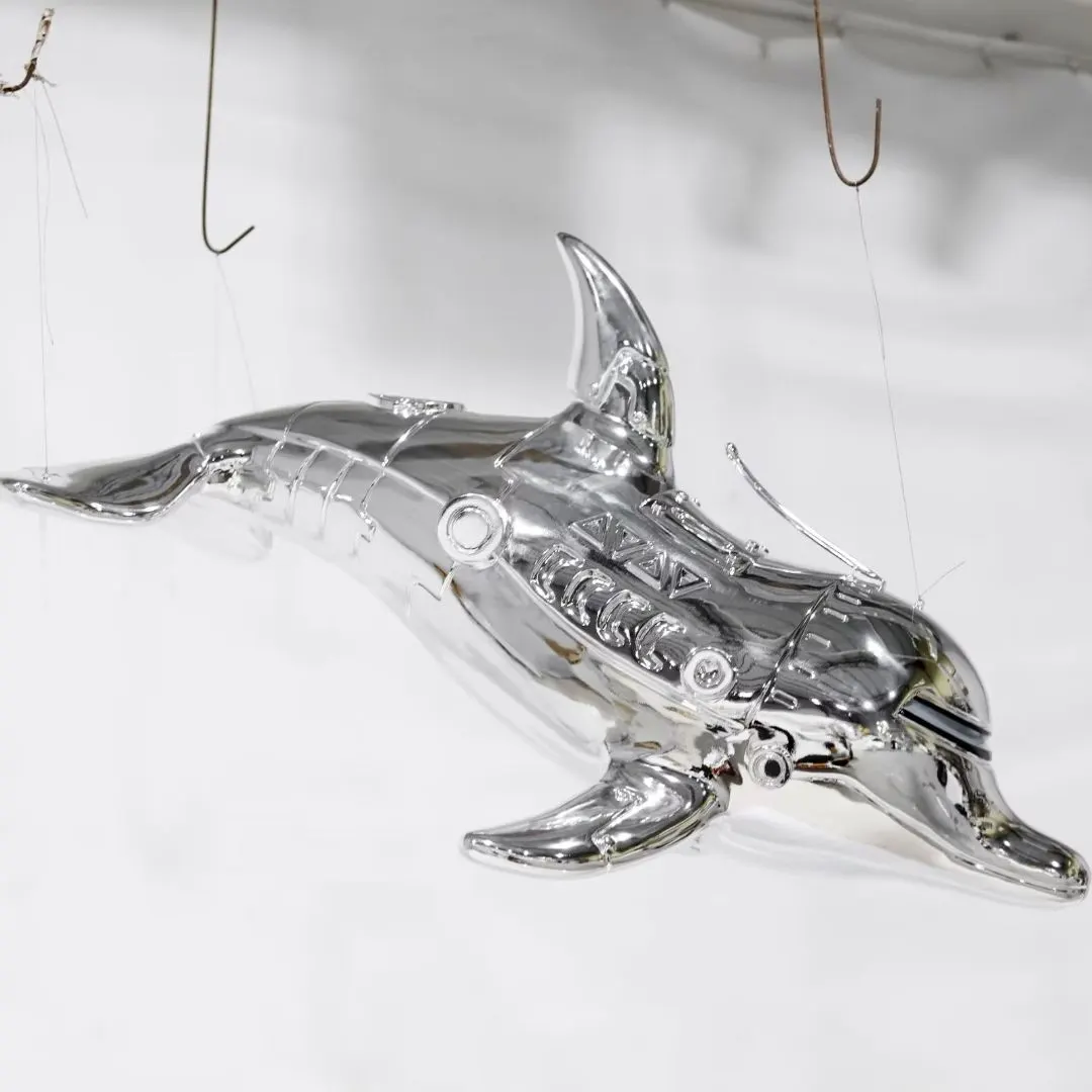 Large suspended sculpture installation in a commercial interior atrium