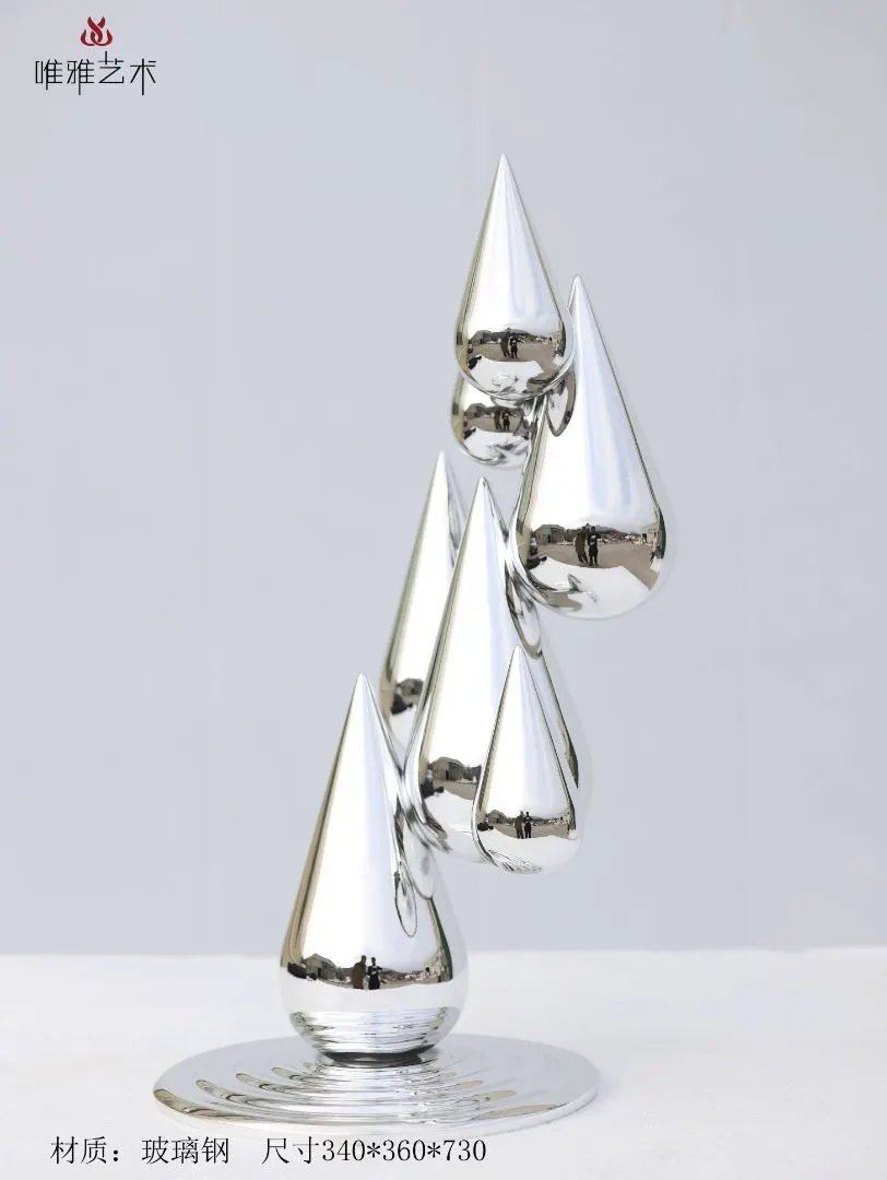 Abstract fiberglass sculpture with metallic plated finish